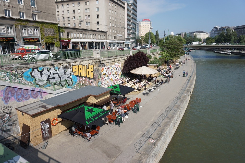 People sunbathing or "beaching" it up near the Danube River