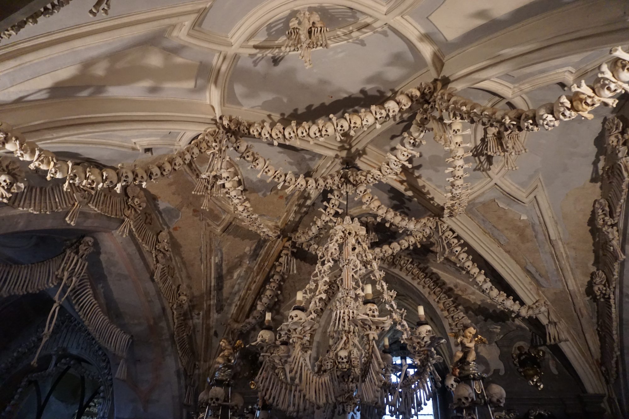the top of Kutna Hora bone church decorated with skulls and other bones